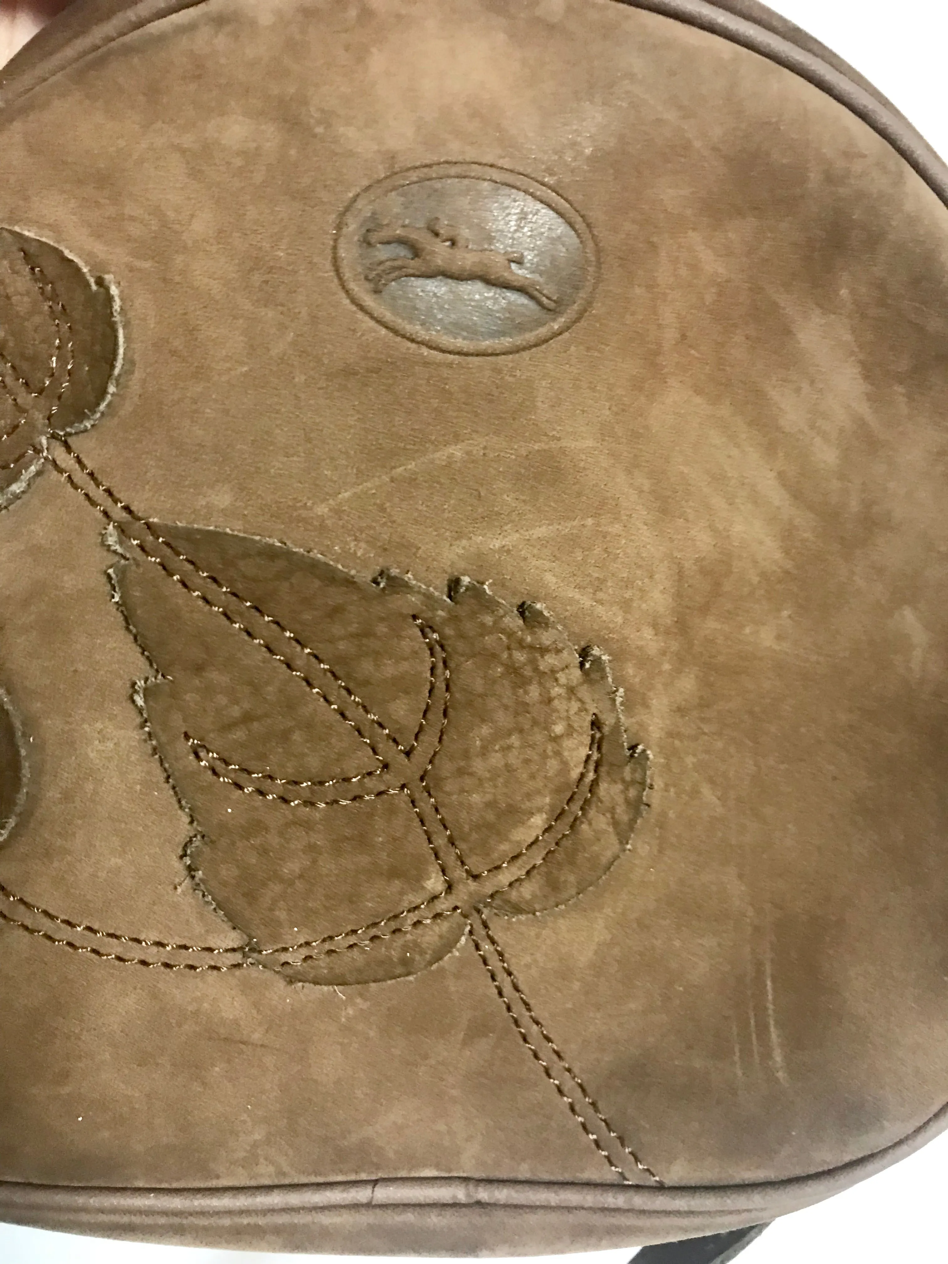 Vintage Longchamp brown suede leather oval round shape shoulder bag with leaf applique motifs. Rare and unique bag back in the okd era.