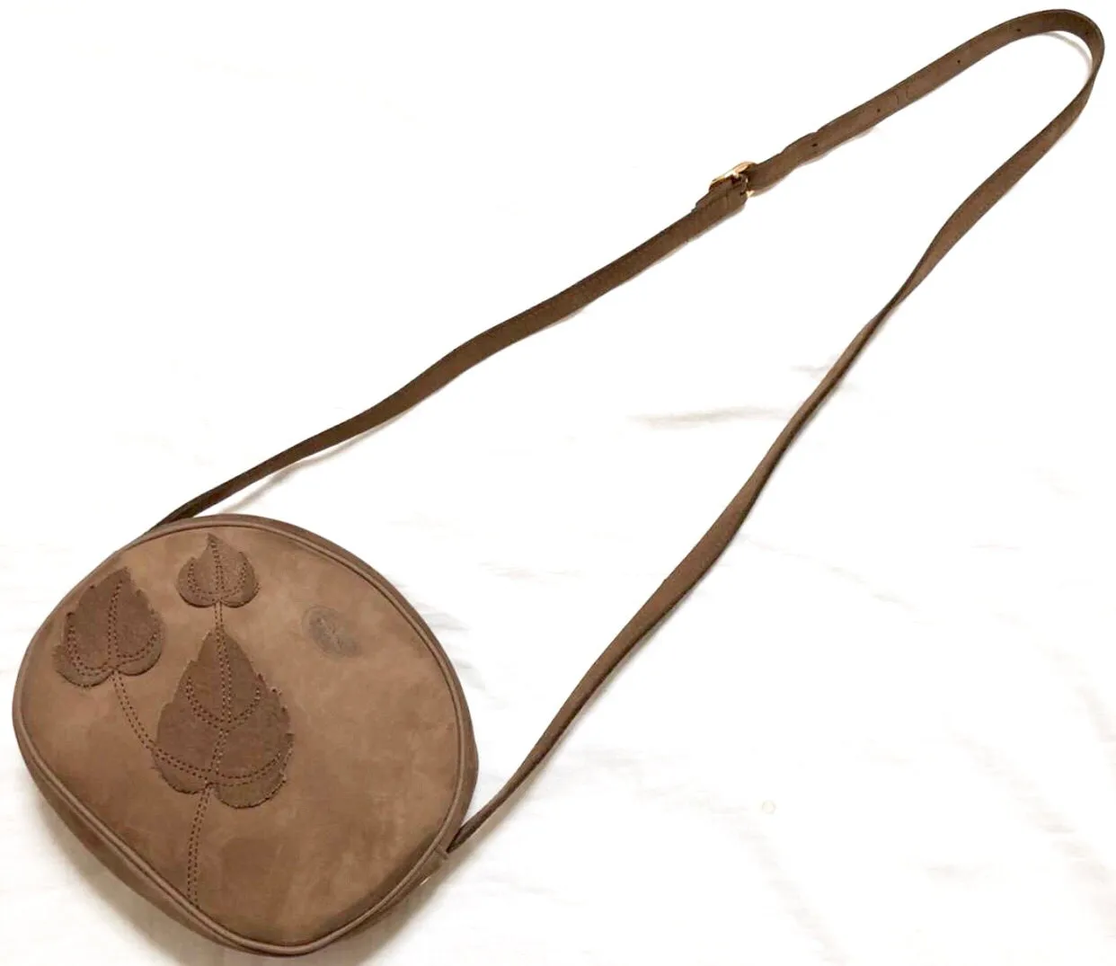 Vintage Longchamp brown suede leather oval round shape shoulder bag with leaf applique motifs. Rare and unique bag back in the okd era.